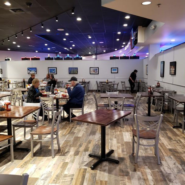A dining room at Ho Chunk Madison with art hanging on the walls