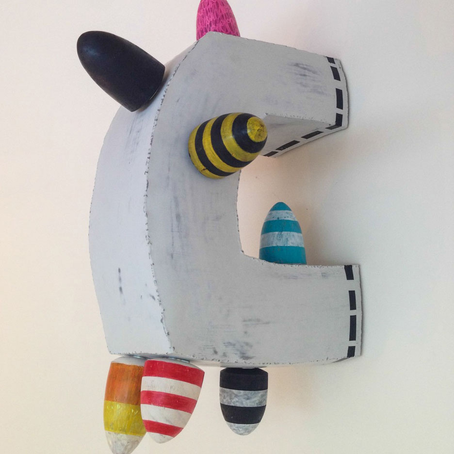 A pop art sculpture hanging on a wall